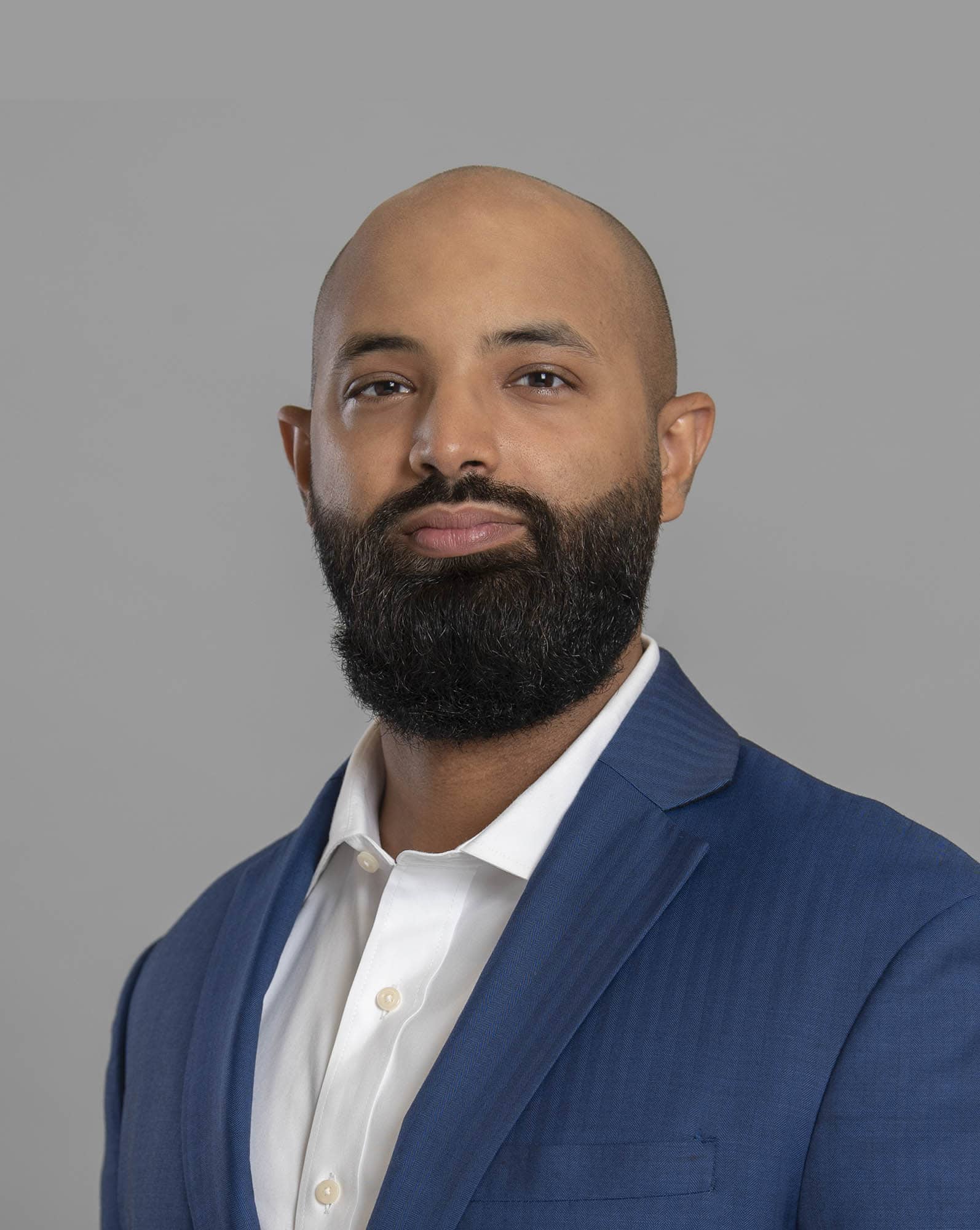 A professor stands among students during a class