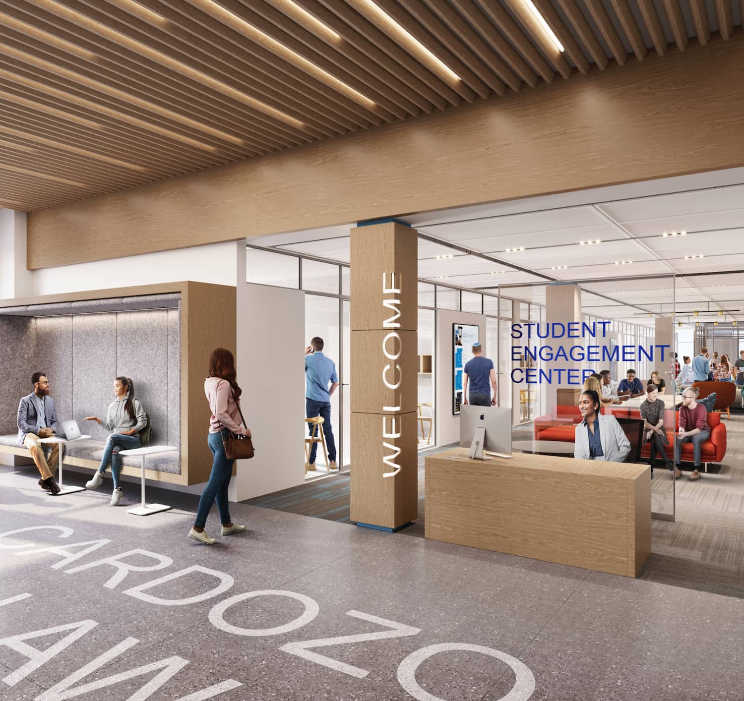 Two students play a piano in one of the common areas
