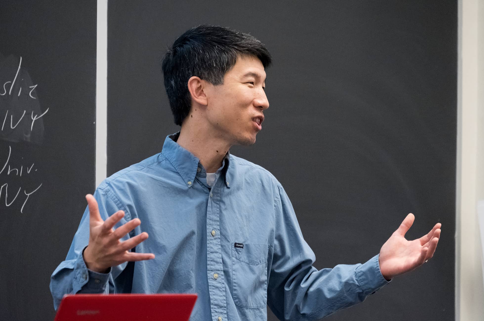 A professor gives a lecture in classroom