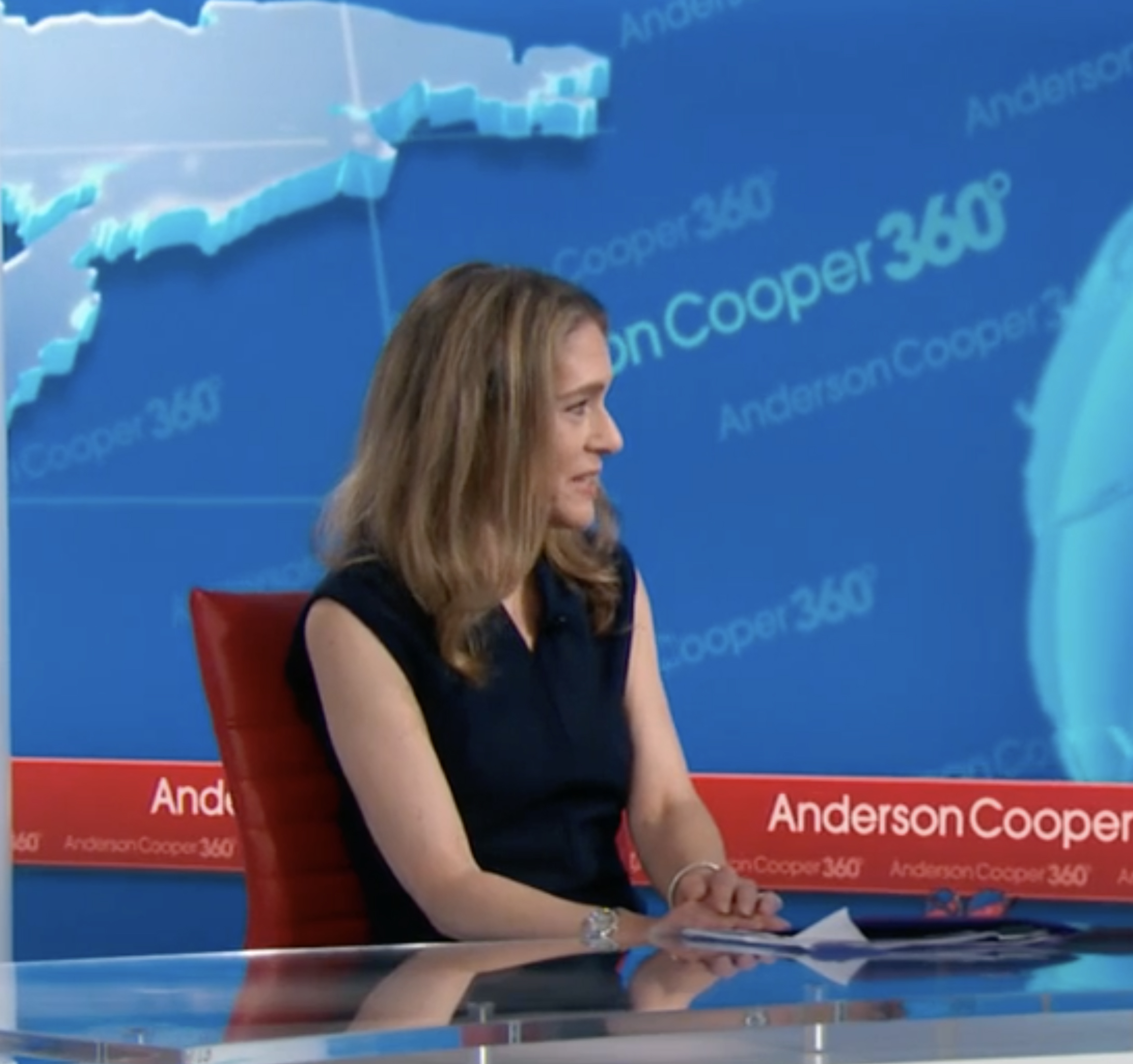 Two students play a piano in one of the common areas